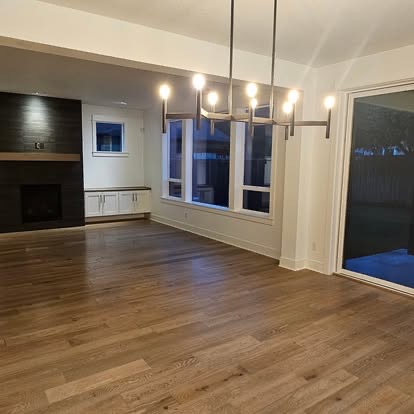Dining area under a modern chandelier